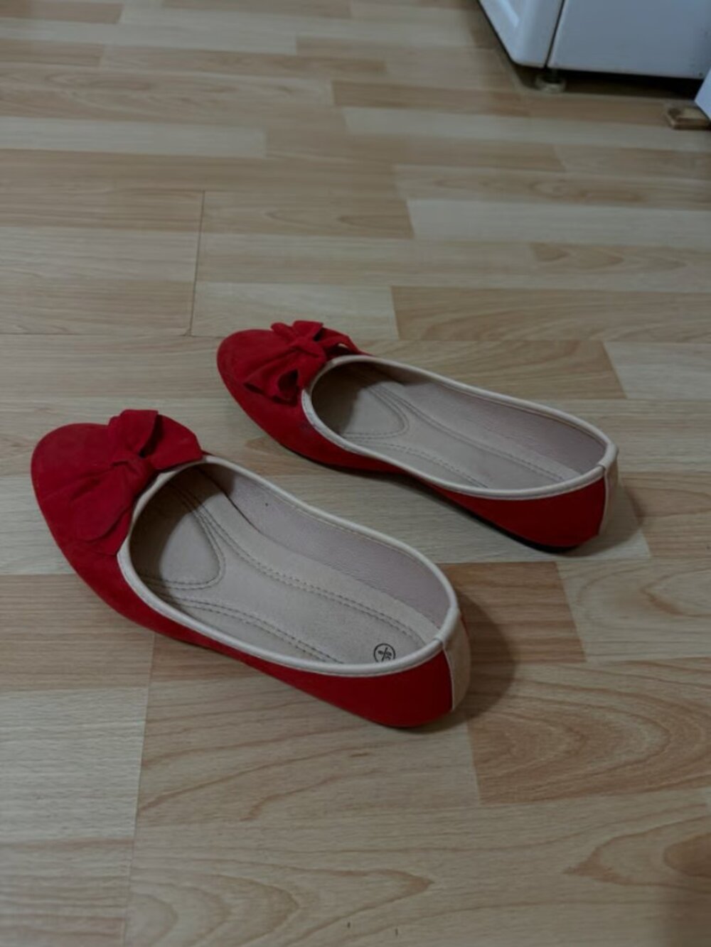 Red woman’s flat shoes